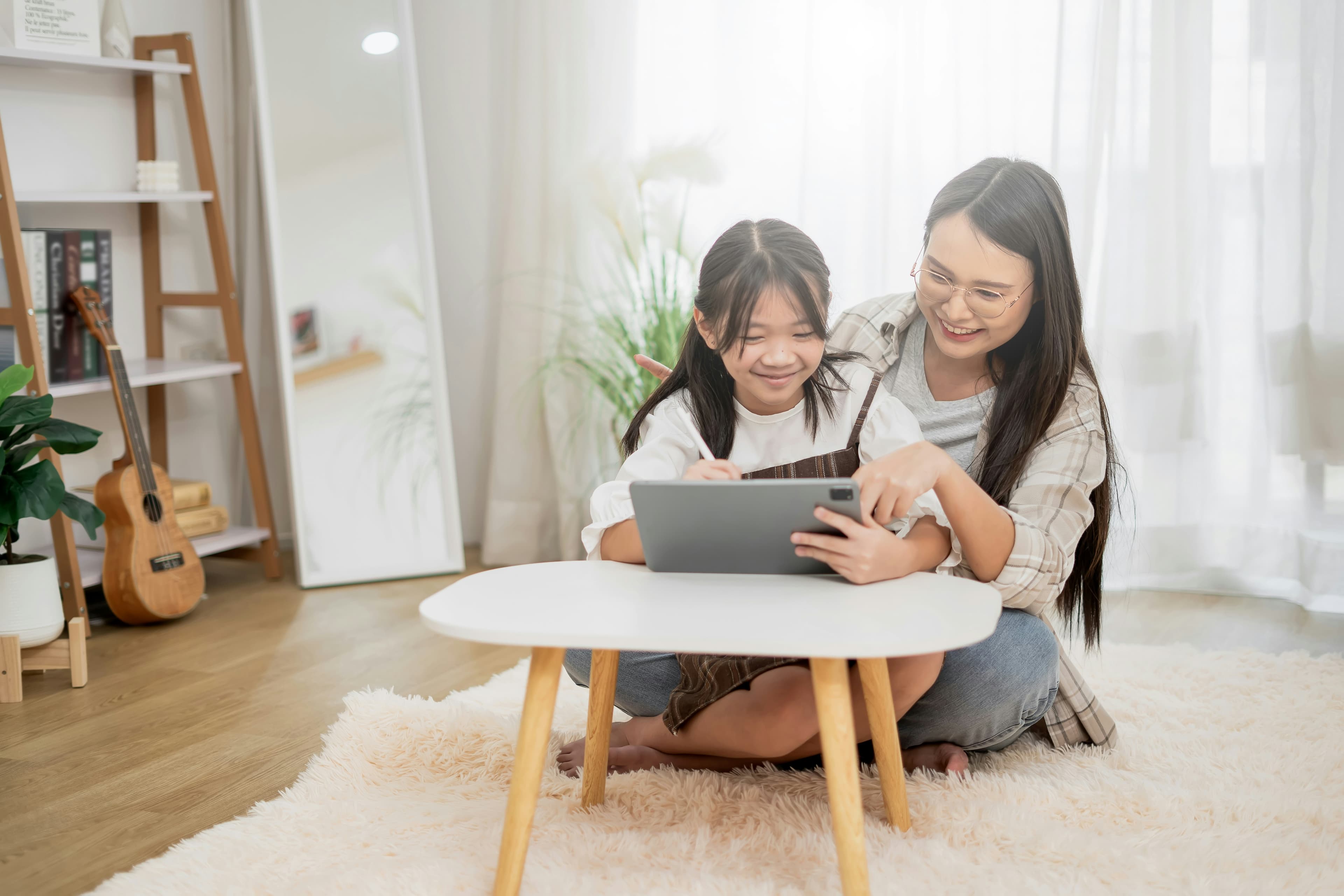 Child picking a birthday party theme with parent