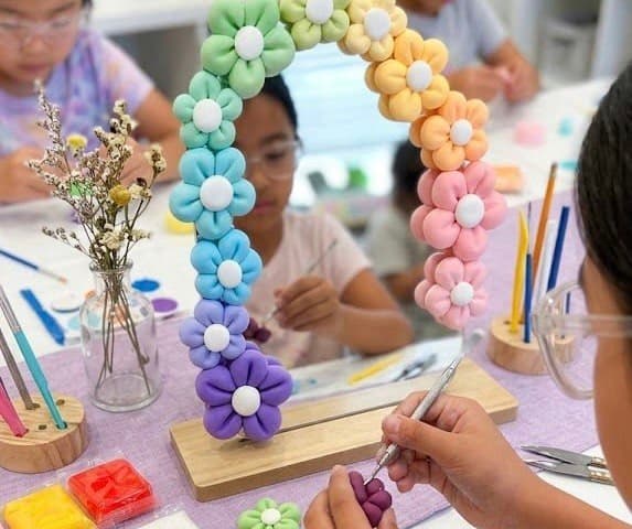 Older girl enjoying a craft party activity in Singapore
