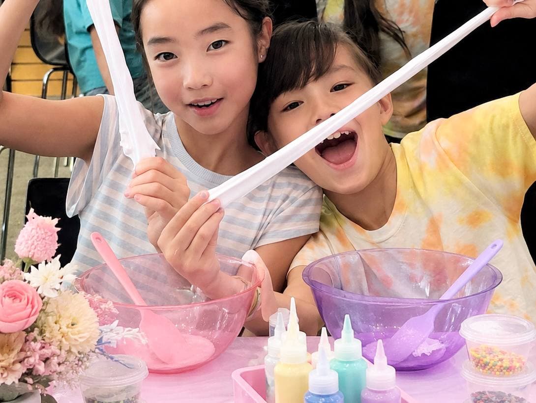 Young girl enjoying a craft workshop at a birthday party